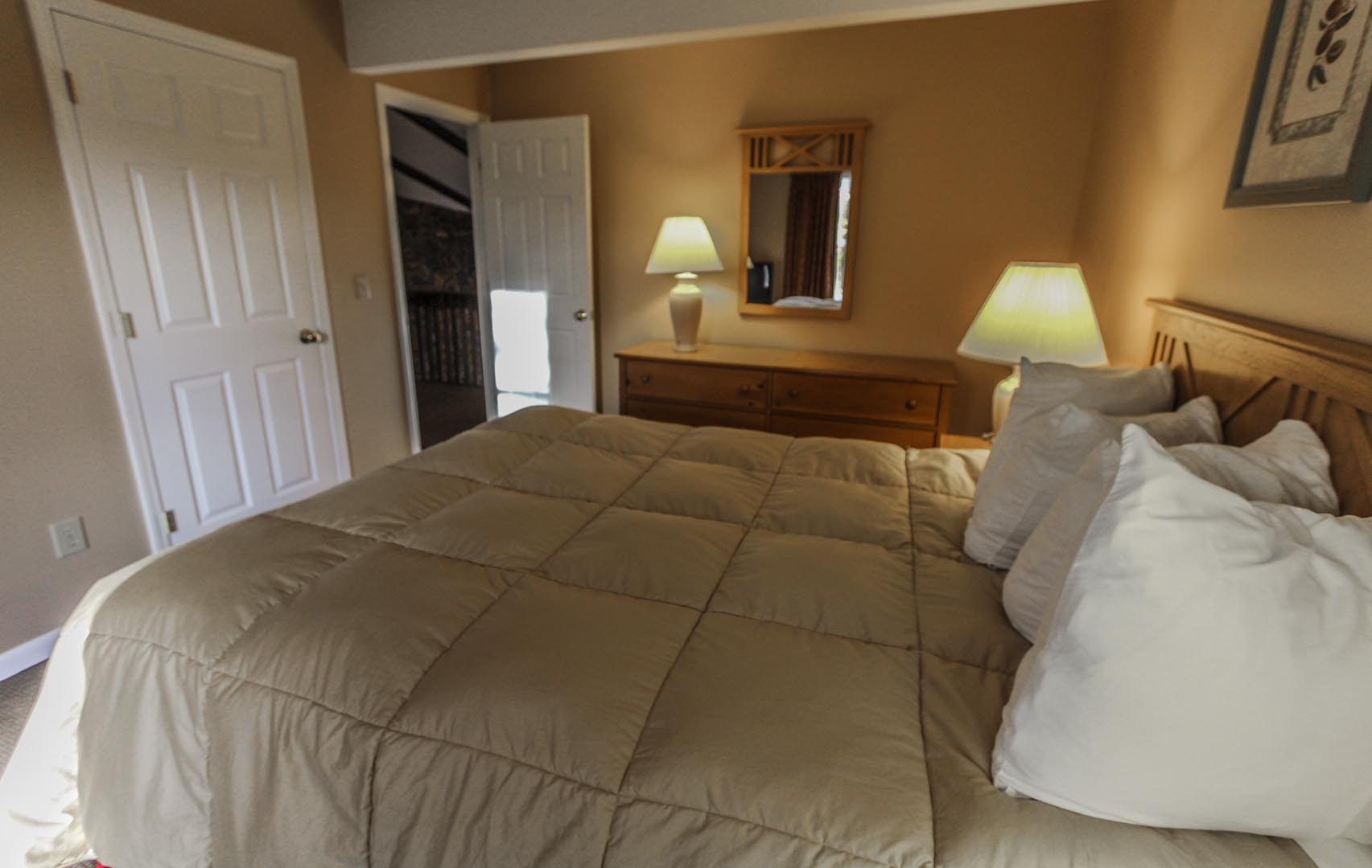 A comfy master bedroom at VRI's Lake Placid Club Lodges in New York.